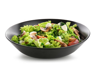 Bowl with tasty fresh salad on white background