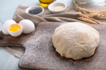 Fototapeta na wymiar Raw dough for making bread on table