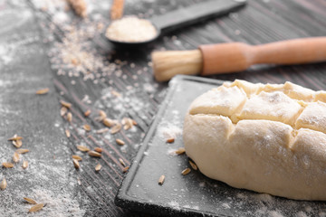 Raw bread on wooden table