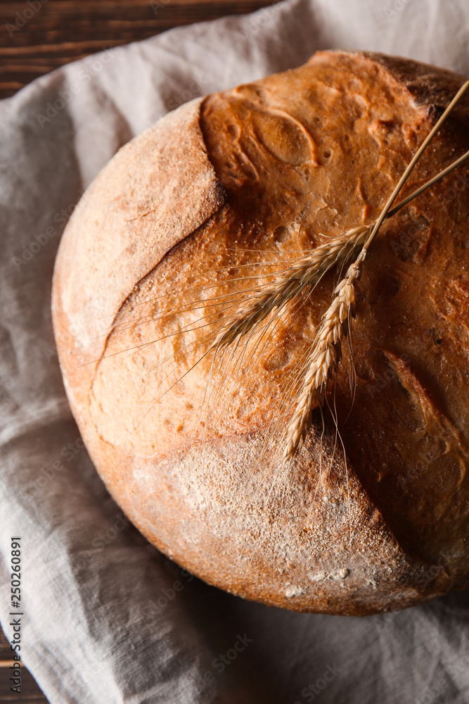 Wall mural loaf of fresh bread on table