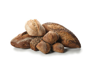 Loaves of fresh bread on white background
