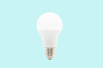 Close up LED white light bulb isolated on blue background. Clipping path -Image.