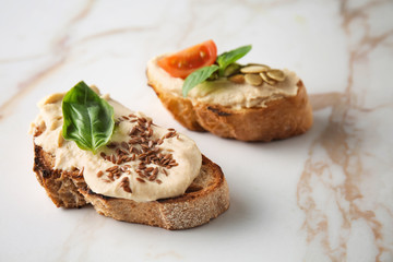 Fresh tasty bruschettas on light background