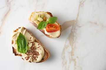 Fresh tasty bruschettas on light background