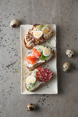 Plate with fresh tasty bruschettas on table