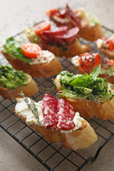 Fresh tasty bruschettas on cooling rack