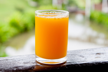 Close up orange juice on wood