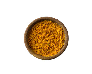 Turmeric in a wooden bowl isolated on white. Spice turmeric isolated on white background. Turmeric with copy space for text.