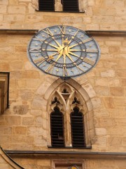 The window and the clock on the building of the Church of St. Jacob.