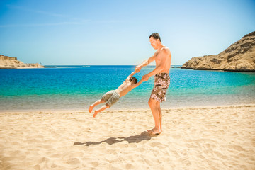 Happy parent with child playing on sea background