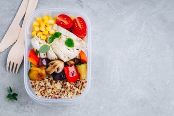 Meal prep containers with quinoa, grilled vegetables and chicken