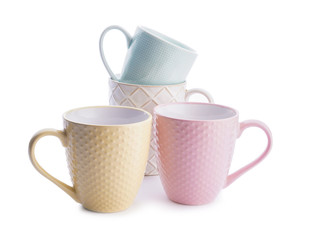 Colorful empty cups on white background