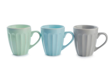 Colorful empty cups on white background