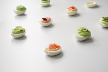 Tasty deviled eggs on white background