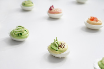 Tasty deviled eggs on white background
