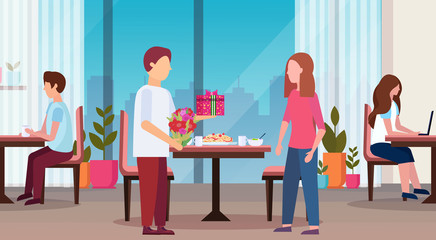 man giving present gift box surprise for woman happy 8 march womens day concept husband making surprise to wife modern restaurant interior full length flat horizontal
