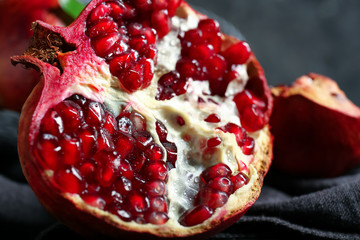 Tasty ripe pomegranate on table, closeup