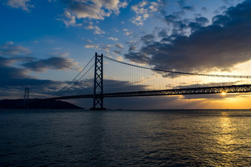 Fototapeta na wymiar Akashi Kaikyo bridge at sunset