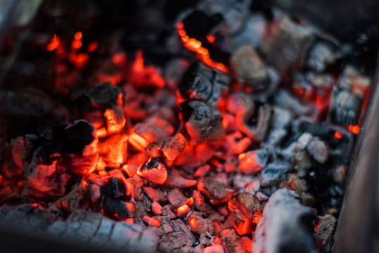 Burning red coals in the fire