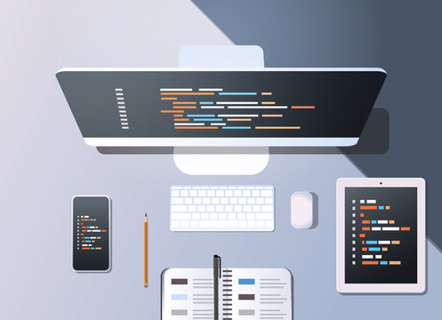 web site design development program code programming concept top angle view desktop computer monitor tablet smartphone screen organizer office stuff horizontal