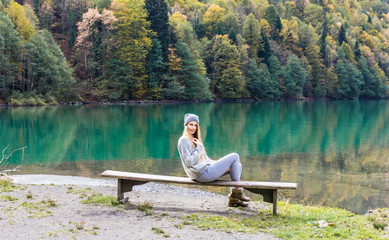 Beautiful girl on a background of lake, mountain lake