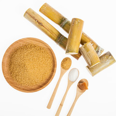 white sugar, brown sugar and sugar cane panela on white background