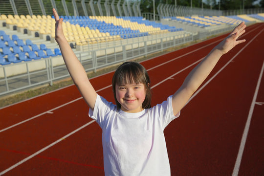 Little girl have fun on the stadium