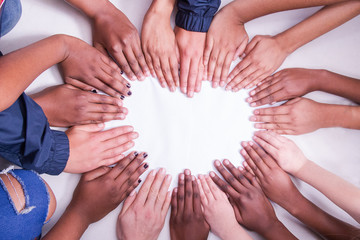 multi national skin colour hands in a heart shape