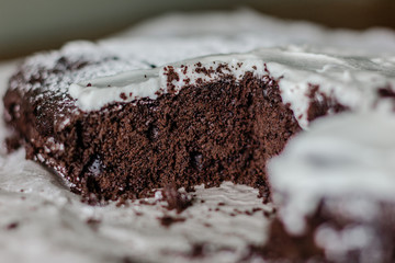Close up of chocolate pie with flowing cream