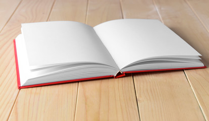 Open book on wooden table