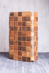 An exhibition sample of an angular tile with inserts under a tree