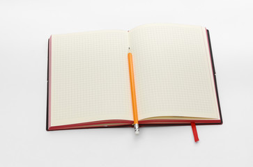 Business concept. Top view collection of notebook, white open flip curl rolled page and pencil on background for mockup