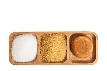 white sugar, brown sugar and sugar cane panela on white background