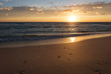 Fototapeta na wymiar Sunset on the sea beach