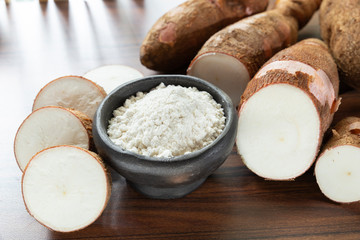 Raw yucca starch on the wooden table - Manihot esculenta.