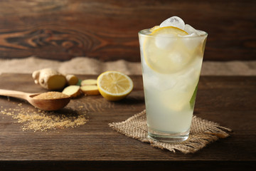 Glass of fresh lemonade with ice on table