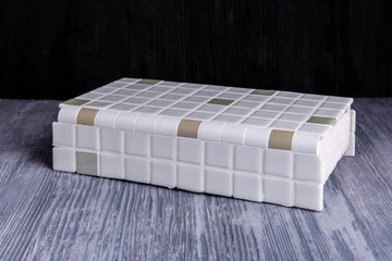 A sample of an opaque angular tile for bathrooms and kitchen