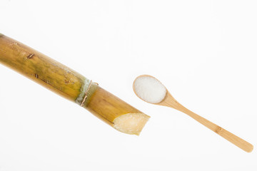 wooden spoon with white sugar, on white background