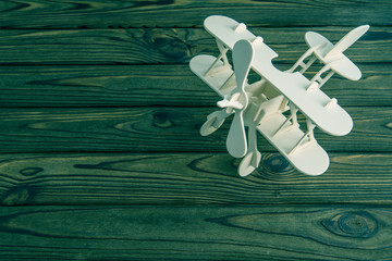 wooden plane on wooden background transport, travel.