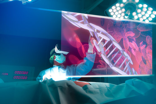 Doctor with virtual reality in operation room in hospital. Surgeon analyzing patient DNA testing result and human anatomy on technological digital futuristic virtual interface,digital holographic.