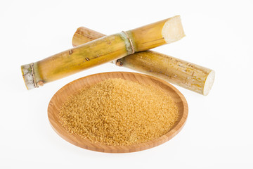 wooden dish with brown sugar on white background