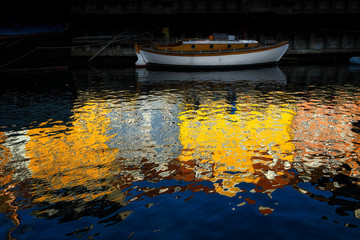 Fototapeta premium Reflection of Nyhavn historic place in Copenhagen Denmark