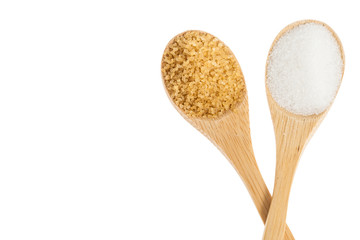 wooden spoons with white sugar and brown sugar on white background