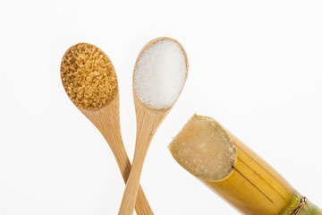 wooden spoons with white sugar and brown sugar on white background