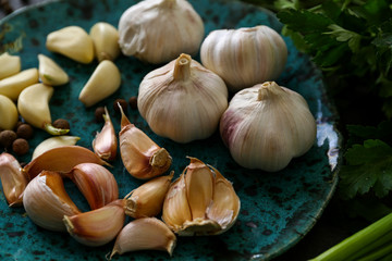 Plate with fresh garlic on table, closeup