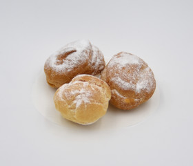 Isolated pastry with cream and sugar dust