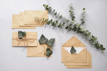 Paper envelopes with floral decor on light background