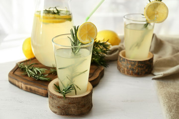 Glassware of fresh lemonade on table