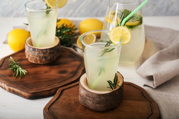Glassware of fresh lemonade on table