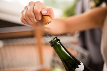 Popping cork champagne closeup smoke steam